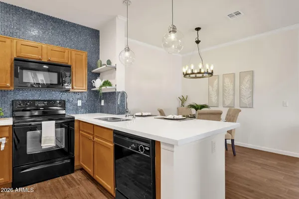 a kitchen with a stove and a microwave