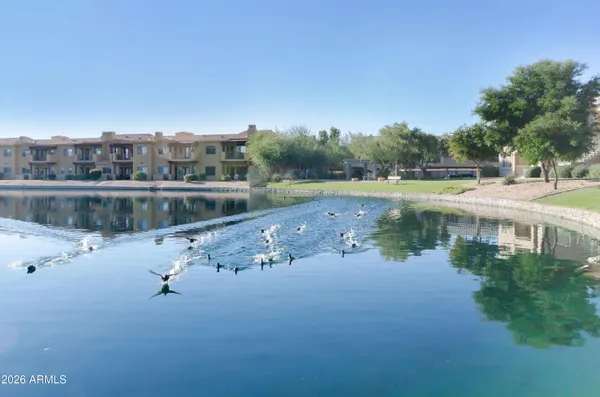 a view of a lake with houses with outdoor space