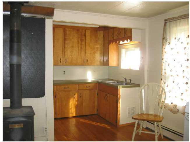 16 Winn Road Winn, ME 04495 - Photo 14 of 35 Kitchen. Wood stove makes this the...