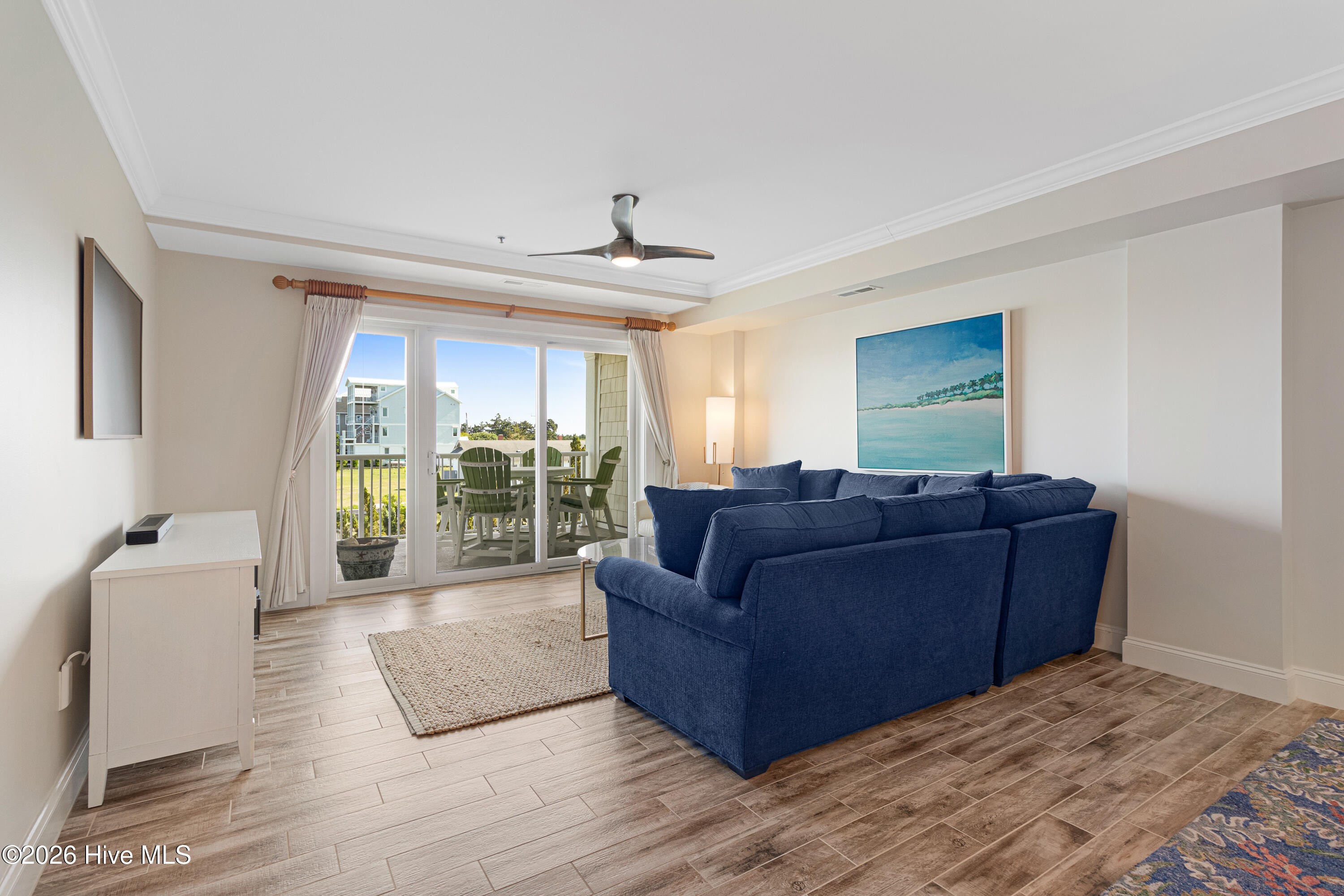 212 Old Causeway Road, Unit 107 & B13 SLIP Beaufort, NC 28516 - Photo 15 of 49 Living room with covered balcony access
