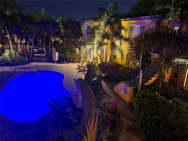 a view of swimming pool with outdoor seating