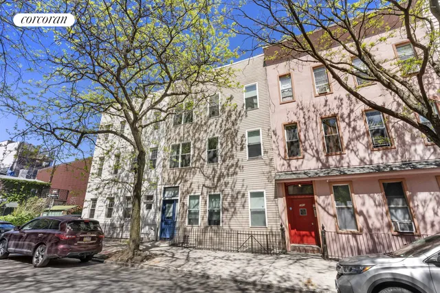 a building with trees in front of it
