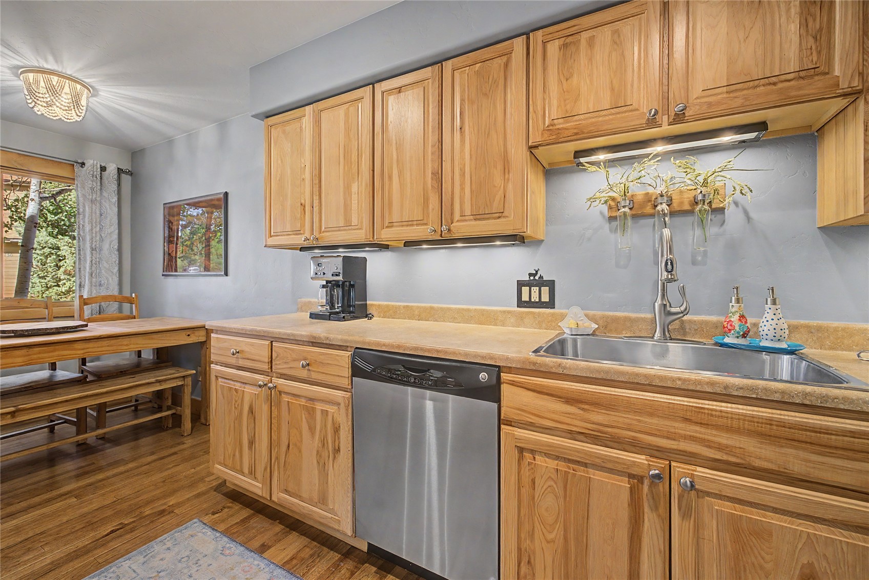 6726 Ryan Gulch Road, Unit 6726 Wildernest, CO 80498 - Photo 11 of 39 a kitchen with stainless steel appliances a stove sink and cabinets