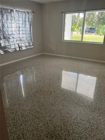 a view of a backyard with a small cabin