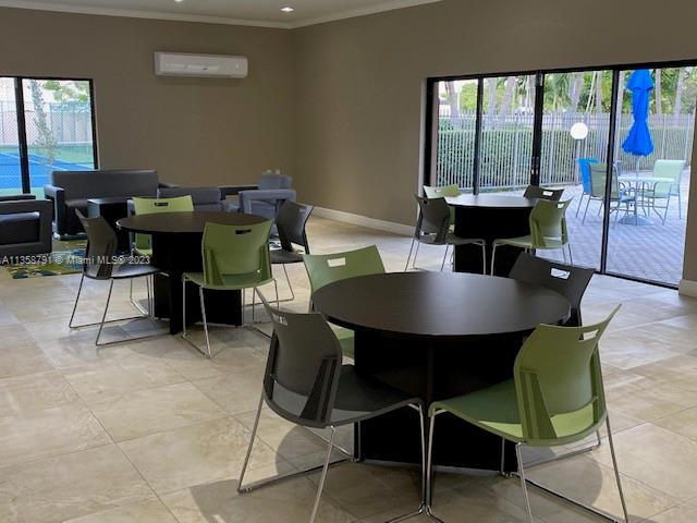 10985 Southwest 107th Street, Unit 305 Miami, FL 33176 - Photo 19 of 20 a view of a dining room with furniture window and outside view
