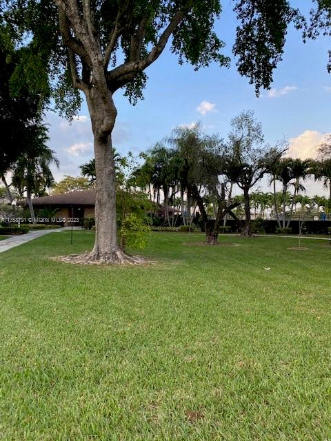 10985 Southwest 107th Street, Unit 305 Miami, FL 33176 - Photo 20 of 20 a view of a park with large trees