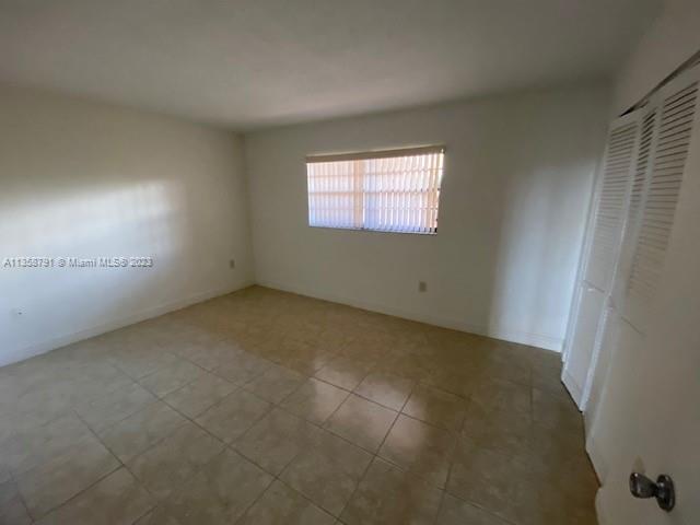 10985 Southwest 107th Street, Unit 305 Miami, FL 33176 - Photo 5 of 20 an empty room with windows
