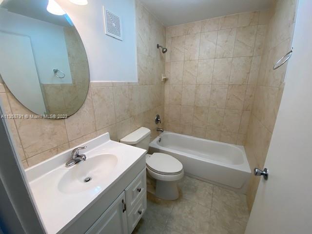 10985 Southwest 107th Street, Unit 305 Miami, FL 33176 - Photo 6 of 20 a bathroom with a sink mirror toilet and bathtub