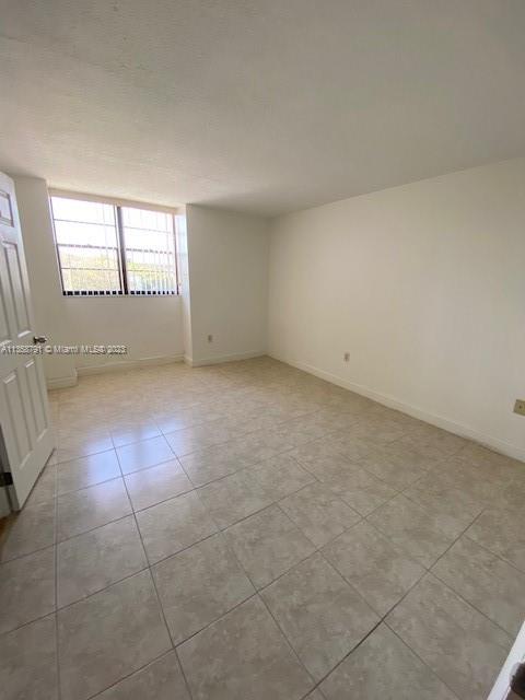10985 Southwest 107th Street, Unit 305 Miami, FL 33176 - Photo 7 of 20 a view of an empty room with a window