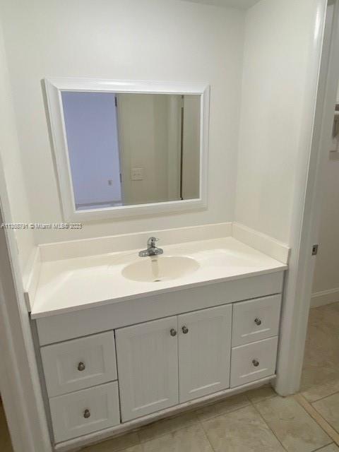 10985 Southwest 107th Street, Unit 305 Miami, FL 33176 - Photo 9 of 20 a bathroom with a sink and a mirror