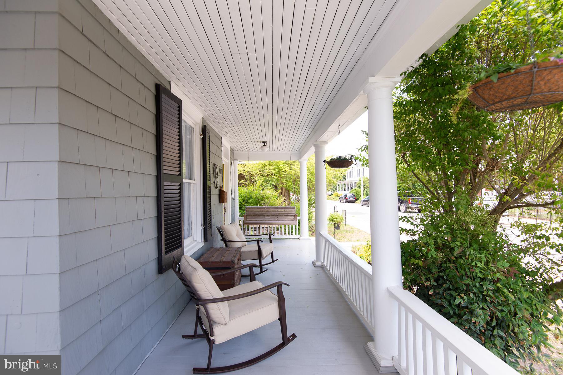 606 Locust Street Cambridge, MD 21613 - Photo 5 of 37 a balcony with furniture and garden view