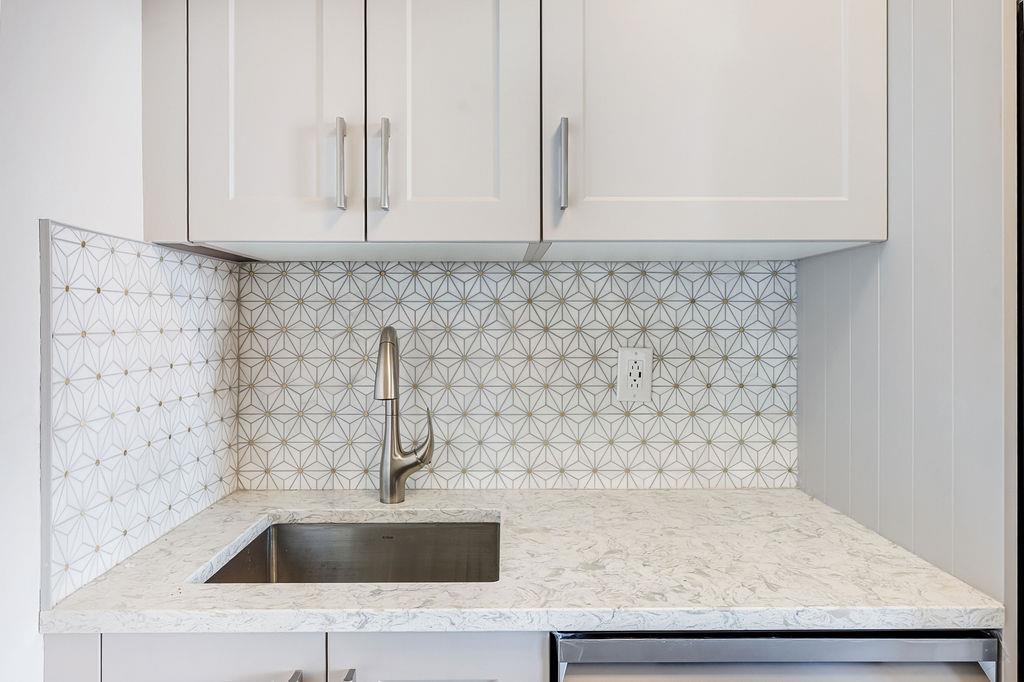 6040 Boulevard East, Unit 22F West New York, NJ 07093 - Photo 12 of 44 a bathroom with a sink and granite