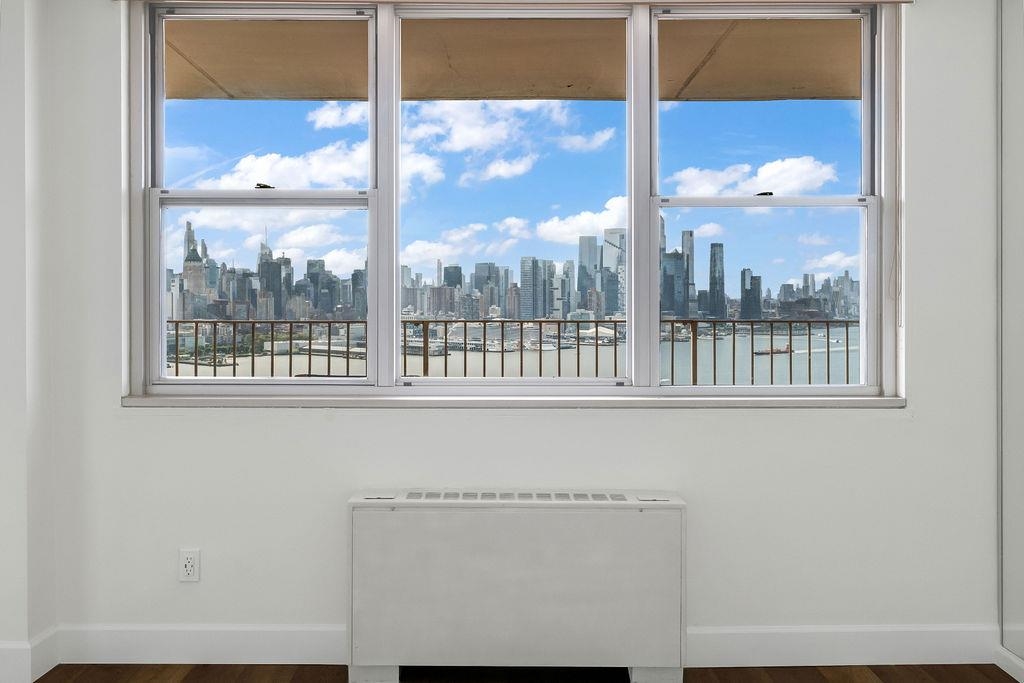 6040 Boulevard East, Unit 22F West New York, NJ 07093 - Photo 21 of 44 a view of a city from a living room