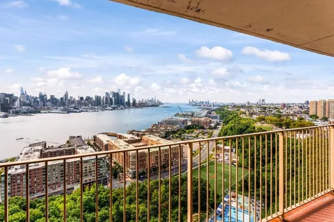 a view of a balcony with city view