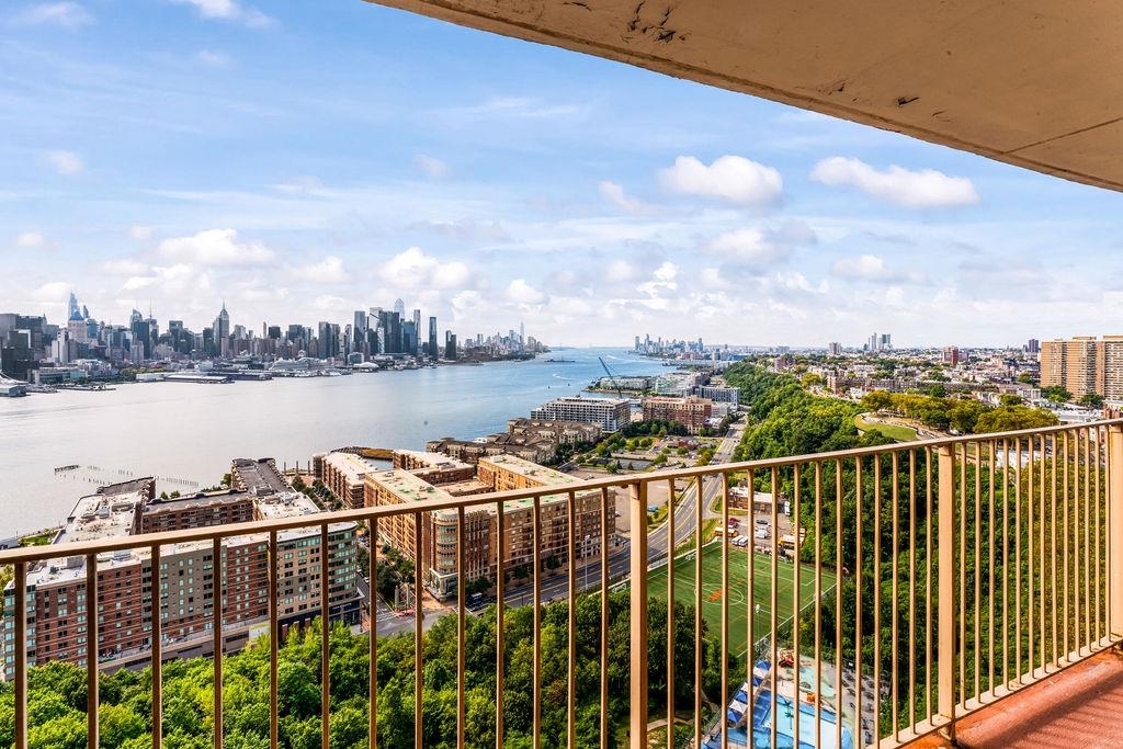 6040 Boulevard East, Unit 22F West New York, NJ 07093 - Photo 25 of 44 a view of a balcony with city view