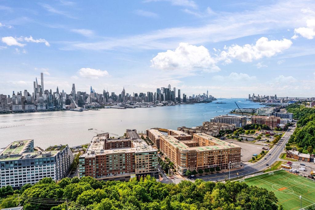 6040 Boulevard East, Unit 22F West New York, NJ 07093 - Photo 26 of 44 a terrace with outdoor seating and city view