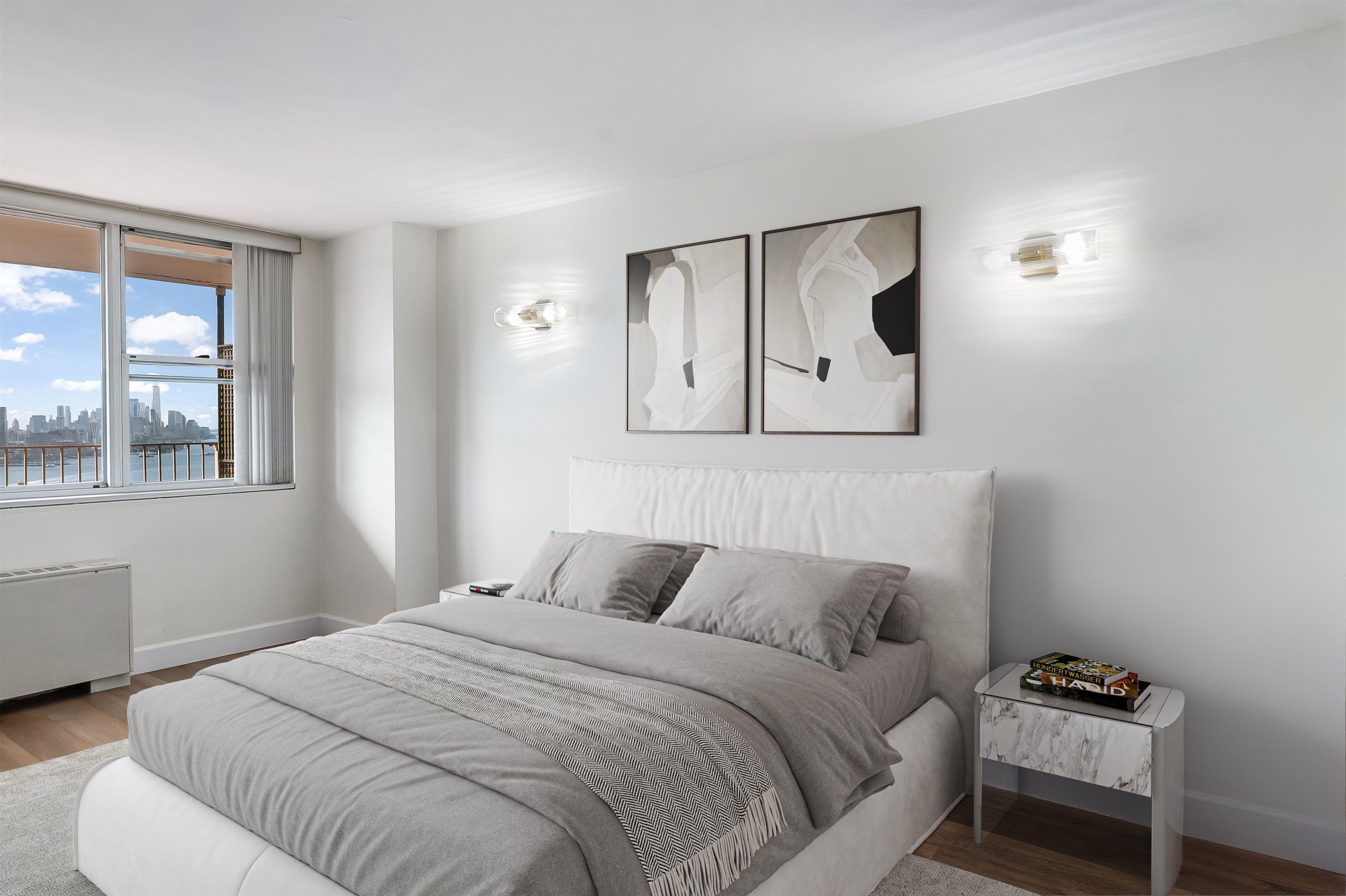 6040 Boulevard East, Unit 22F West New York, NJ 07093 - Photo 5 of 44 a bedroom with a bed and a painting on the wall