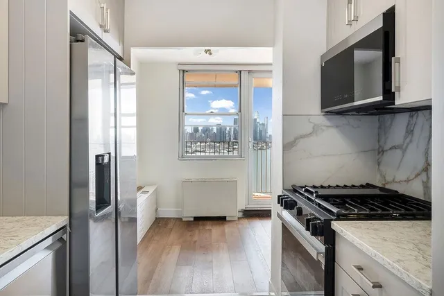 a kitchen with a stove and a microwave