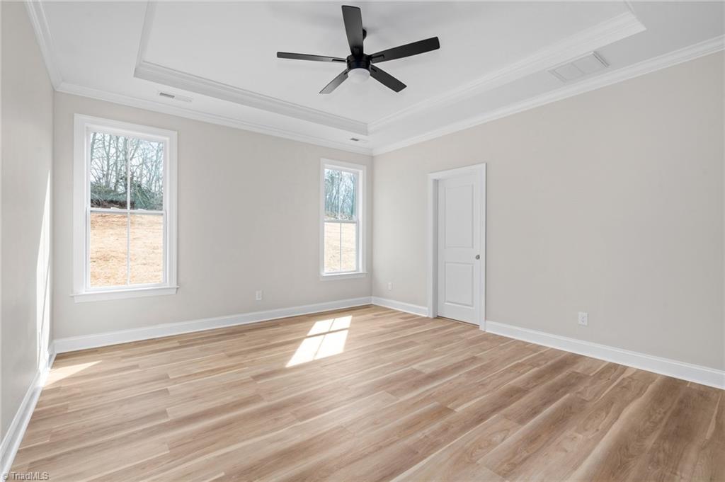 6439 Post Road Thomasville, NC 27360 - Photo 17 of 33 Primary bedroom with tray ceiling