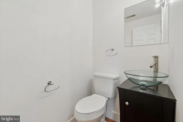 a bathroom with a toilet and a sink