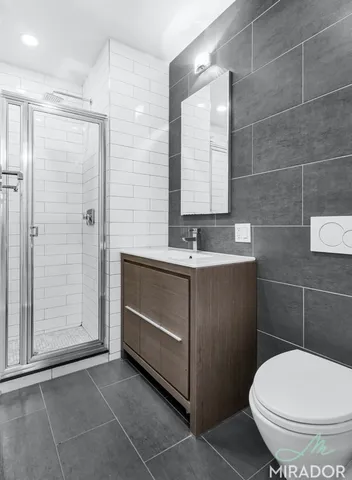 a view of hallway with wooden floor