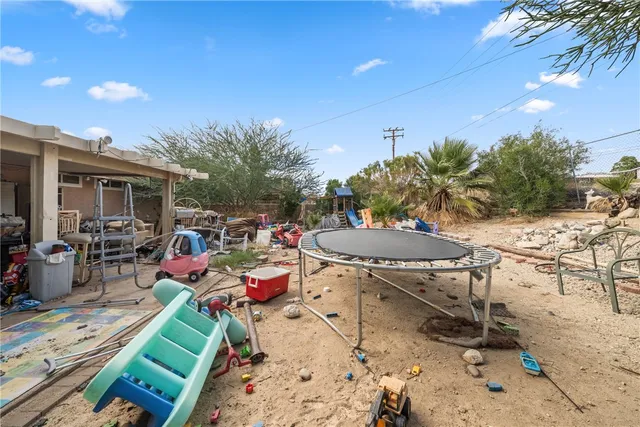 a view of a chairs and table in a patio