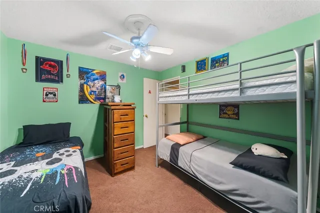 a bedroom with furniture and a window