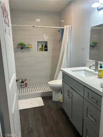 a bedroom with a bed and a fireplace