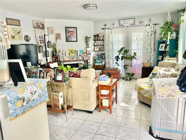 a kitchen with refrigerator and cabinets