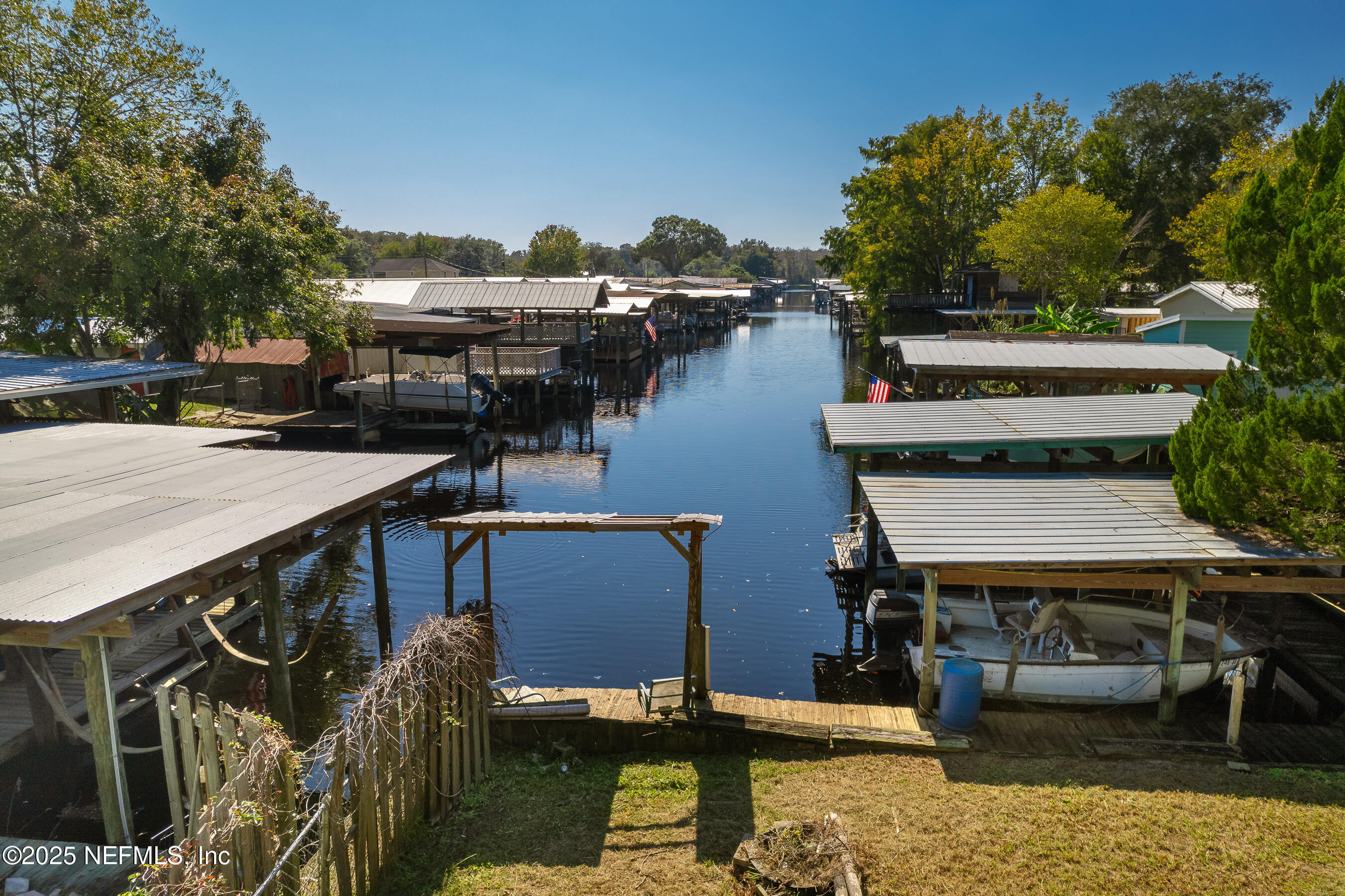 663 Carlin Road Satsuma, FL 32189 - Photo 2 of 19 a view of a house with pool and chairs in a patio