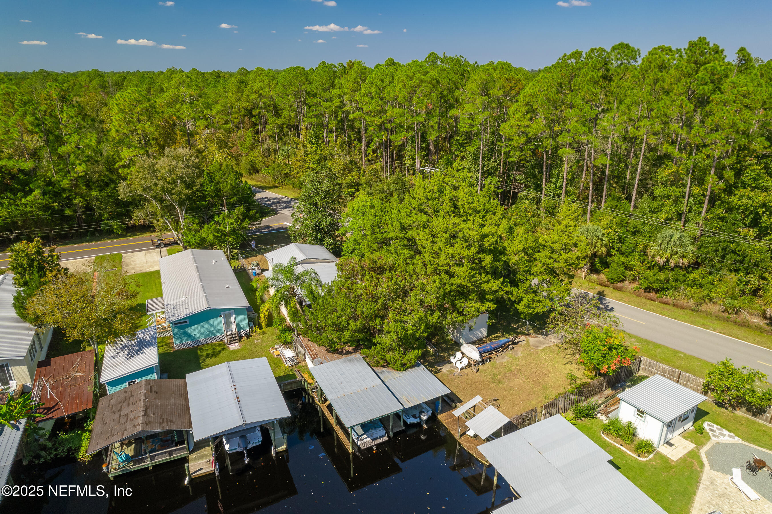 663 Carlin Road Satsuma, FL 32189 - Photo 5 of 19 an aerial view of a house with a garden and pool