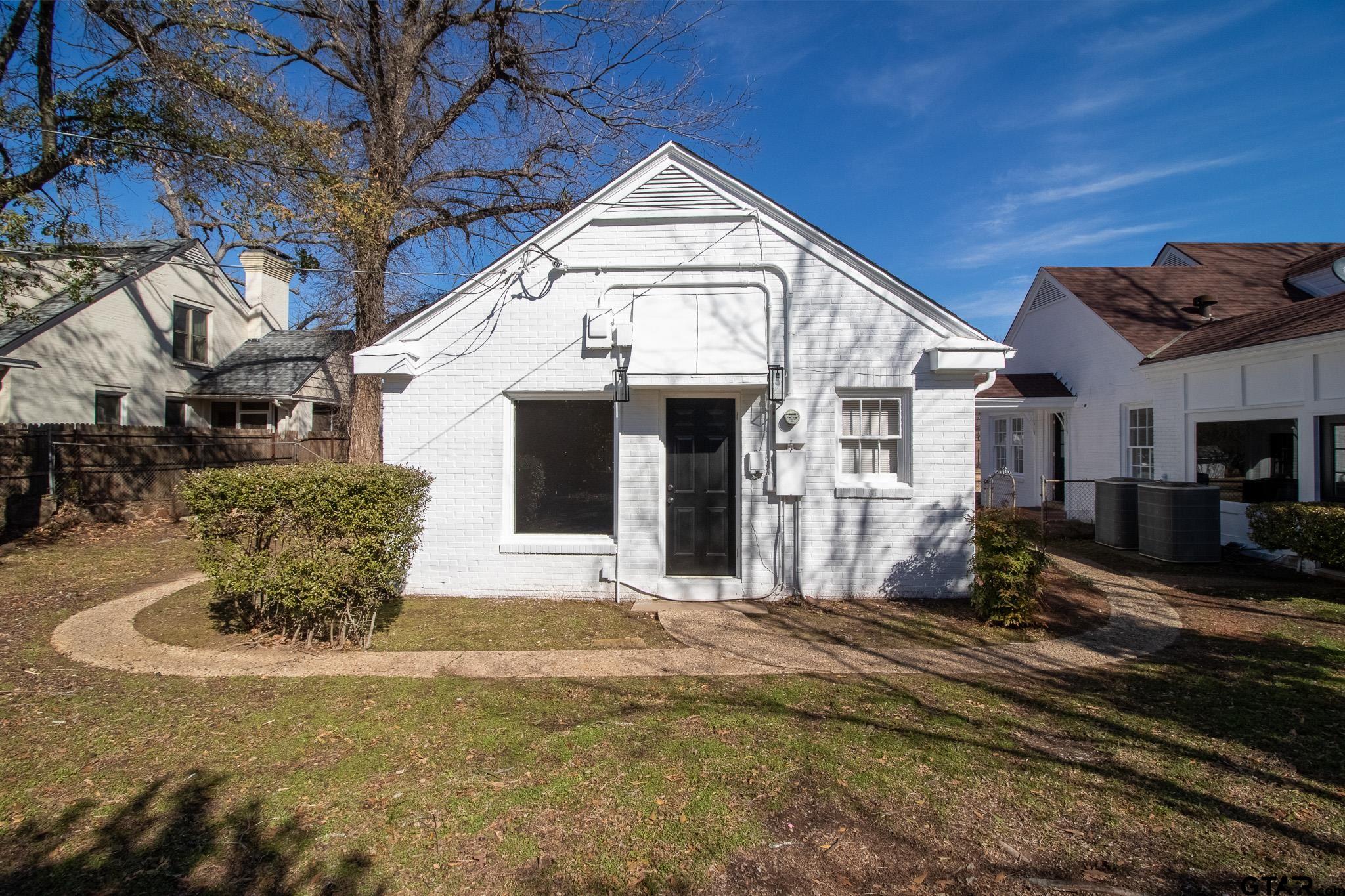 213 East 2nd Street Tyler, TX 75701 - Photo 36 of 48 a view of a house with a patio