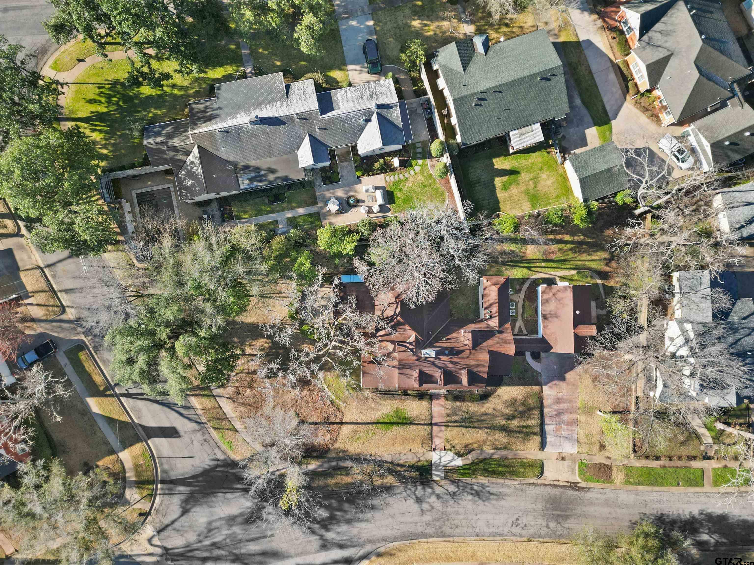 213 East 2nd Street Tyler, TX 75701 - Photo 42 of 48 an aerial view of a house with a yard and lake view