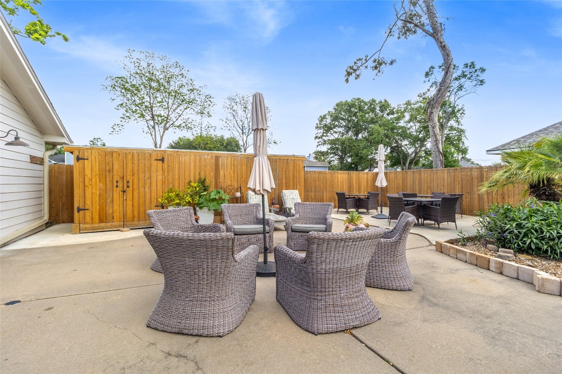 1914 Peppermill Road Houston, TX 77080 - Photo 17 of 43 This is where your evenings naturally wind down—comfortable seating arranged for conversation, morning coffee, or unwinding under the open sky.