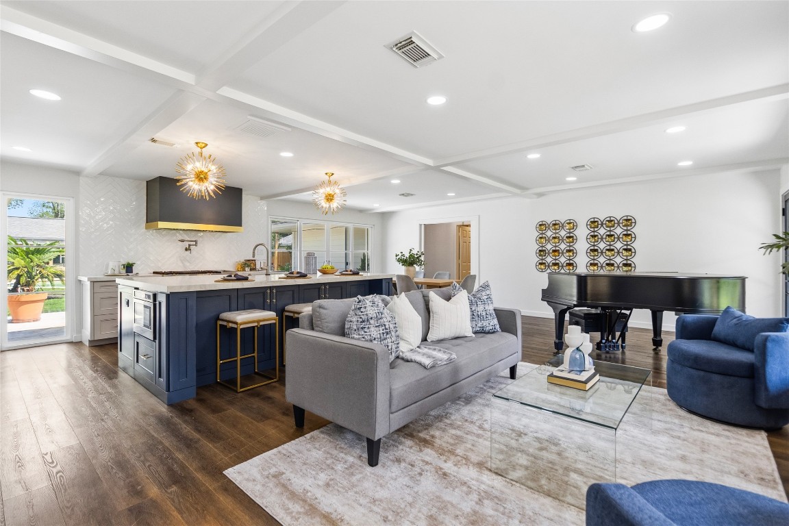 1914 Peppermill Road Houston, TX 77080 - Photo 18 of 43 From here, you can take it all in—the open living space, statement lighting, and kitchen all working together to create a layout that feels both elevated and inviting.