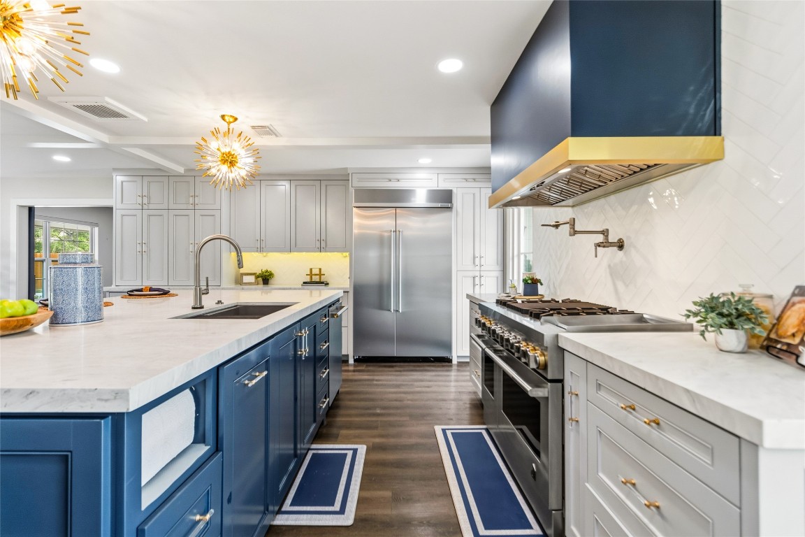 1914 Peppermill Road Houston, TX 77080 - Photo 2 of 43 Cooking here feels elevated, with a professional-style range and expansive counter space that keeps everything within reach exactly when you need it.