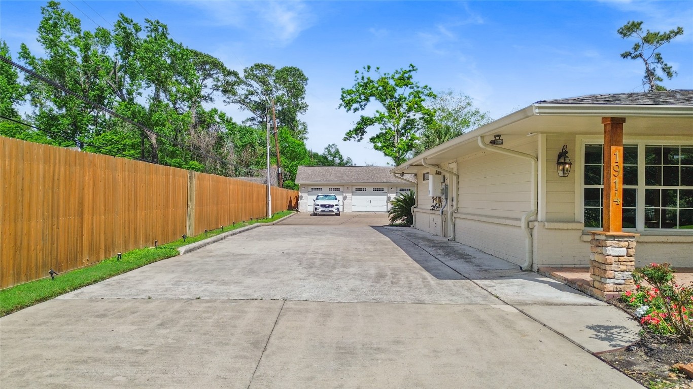 1914 Peppermill Road Houston, TX 77080 - Photo 20 of 43 Pulling in, you immediately feel the space and privacy—your long driveway sets the tone, giving you room for guests, projects, and everything in between.