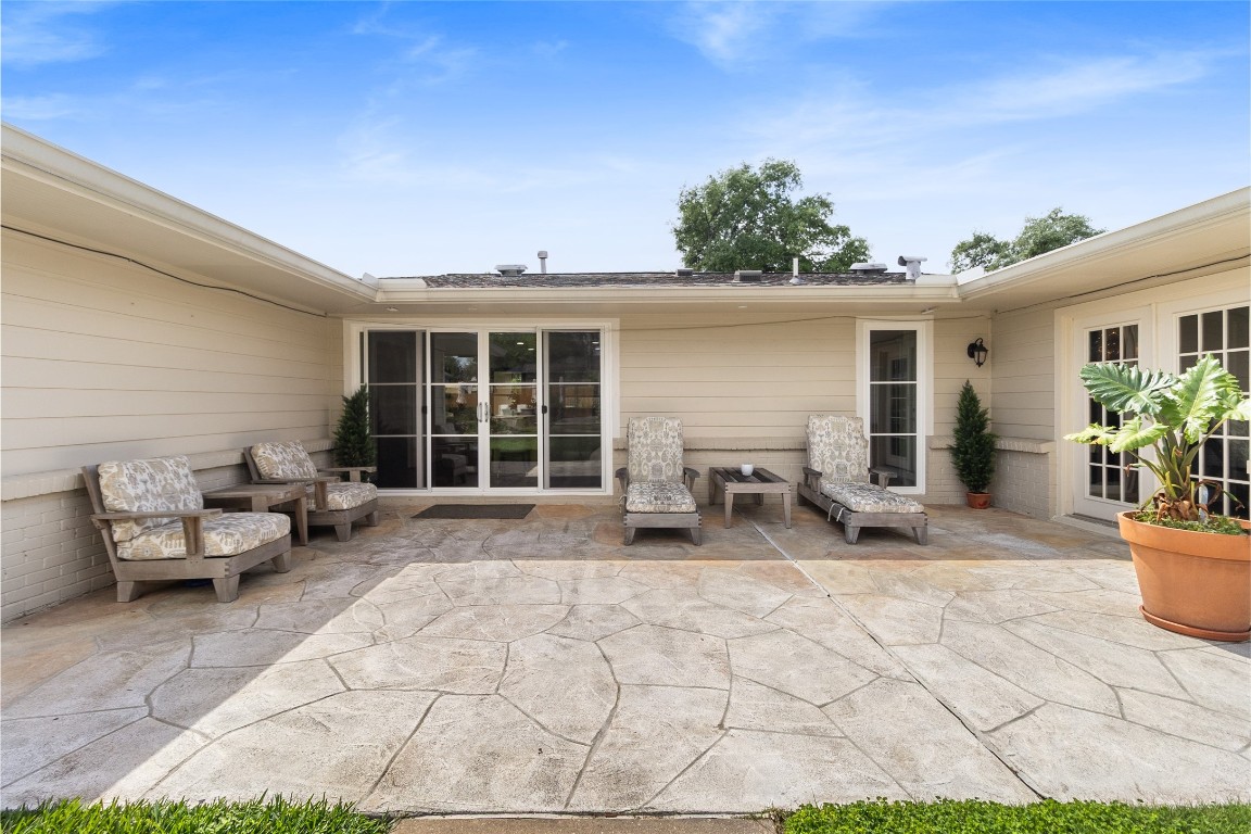 1914 Peppermill Road Houston, TX 77080 - Photo 32 of 43 Right off the home, this patio becomes your everyday extension—perfect for quiet mornings, evening conversations, and easy indoor-outdoor living.