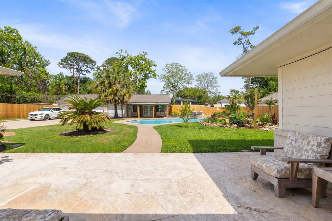 1914 Peppermill Road Houston, TX 77080 - Photo 39 of 43 From your patio, everything opens up in front of you—green space, pool, and gathering areas all connected by a path that naturally draws you outside.