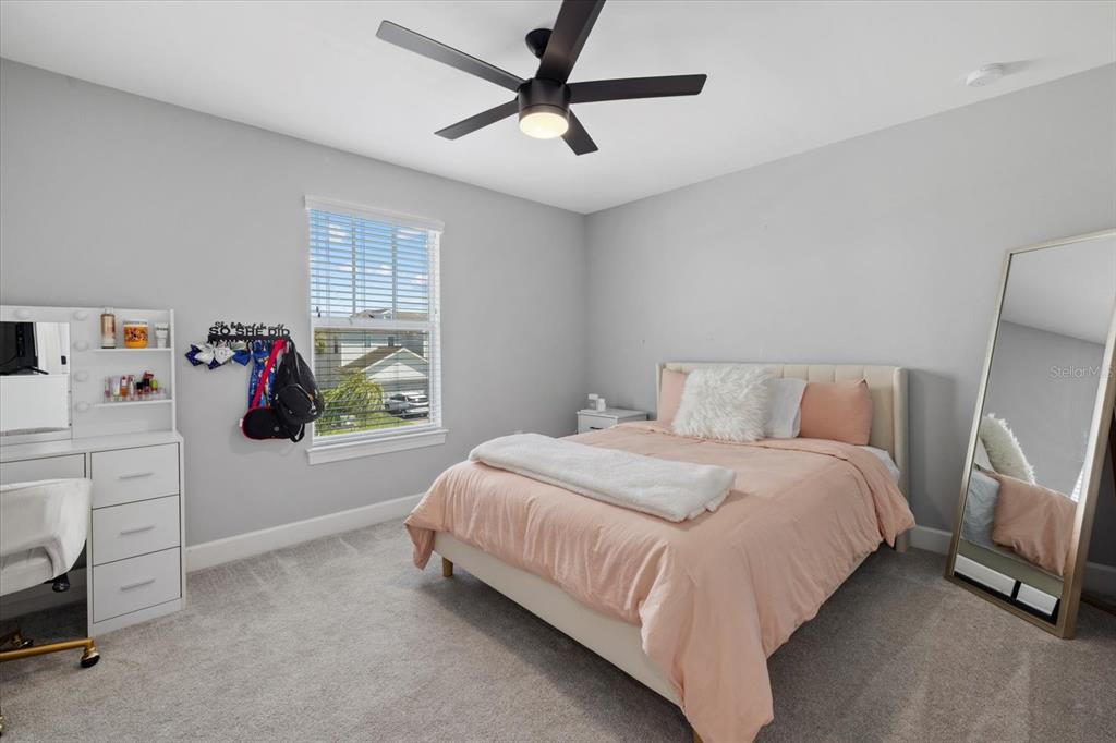 3508 Anchor Bay Trail Lakewood Ranch, FL 34211 - Photo 30 of 74 a bedroom with a bed and a window
