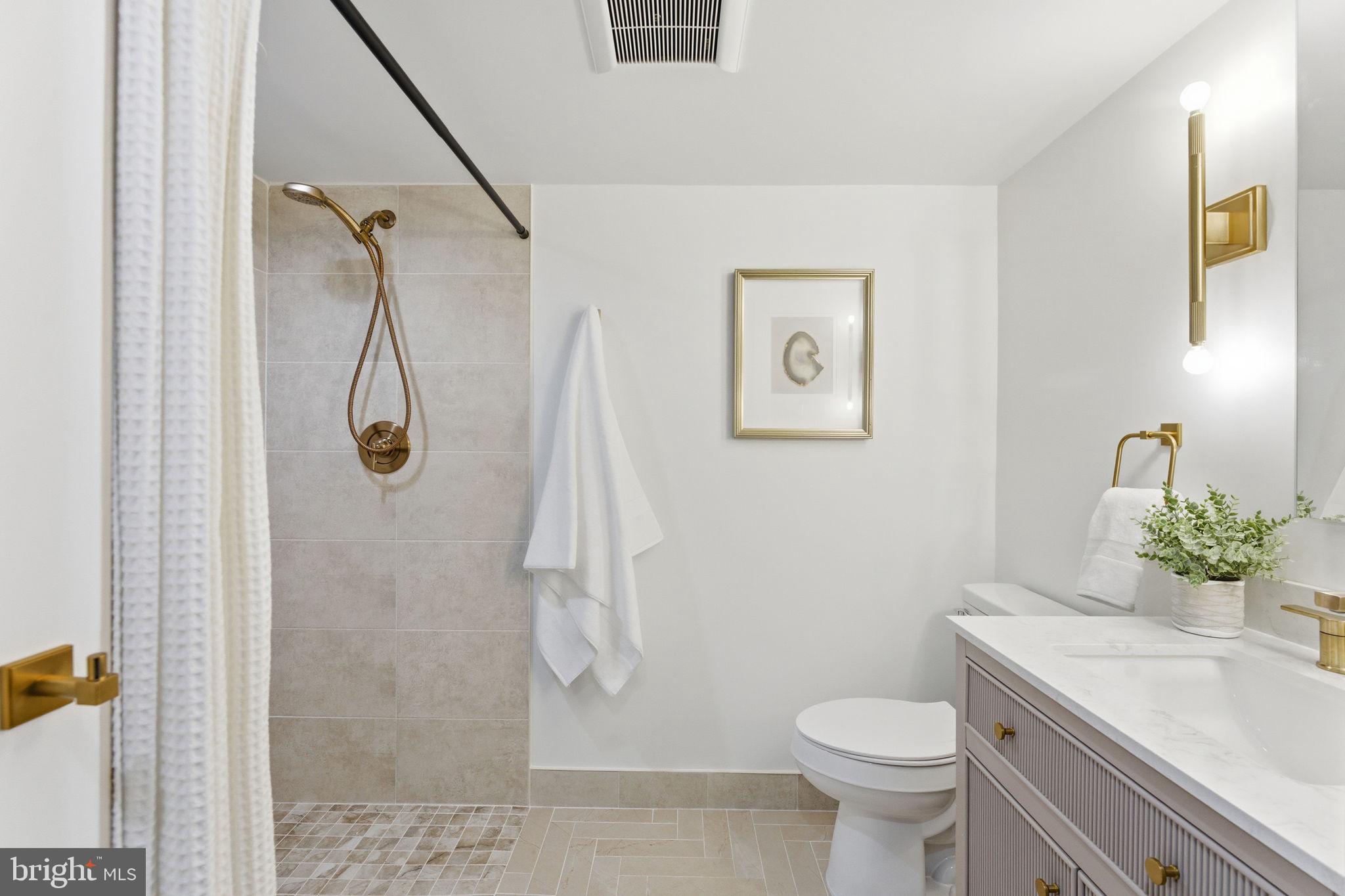 8615 Kerry Lane Springfield, VA 22152 - Photo 40 of 50 a bathroom with a sink toilet and shower