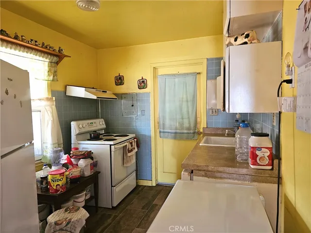 a bed room with a bed and a window