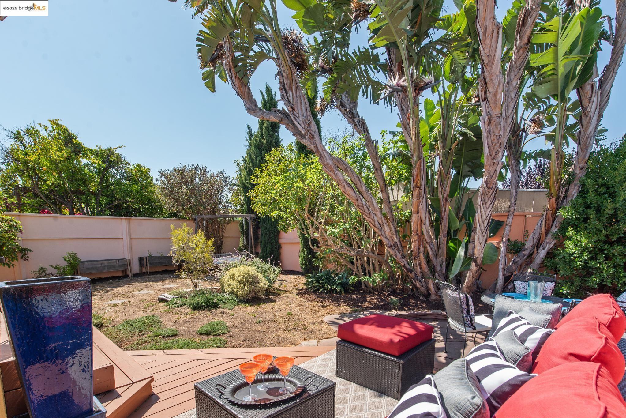 2721 Best Avenue Oakland, CA 94619 - Photo 25 of 28 Wooden deck with an outdoor hangout area and a fenced backyard