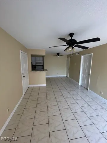 a view of a livingroom with a furniture and a ceiling fan