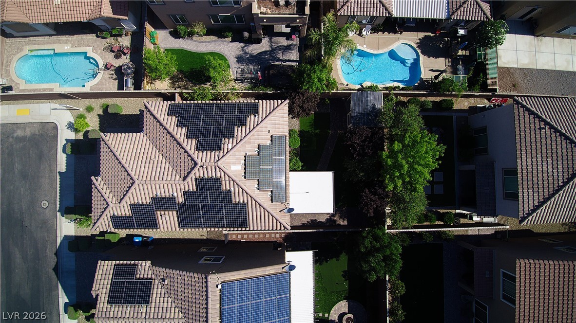 11045 Elk Sands Road Las Vegas, NV 89179 - Photo 63 of 67 An aerial perspective showcases the tiled rooftops and structured layouts of neighboring properties.