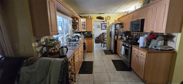 a hallway with furniture and a flat screen tv