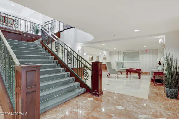 a view of entryway and hall with dining room
