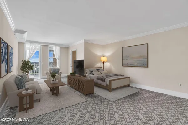 a spacious bedroom with a bed a couch and a large window