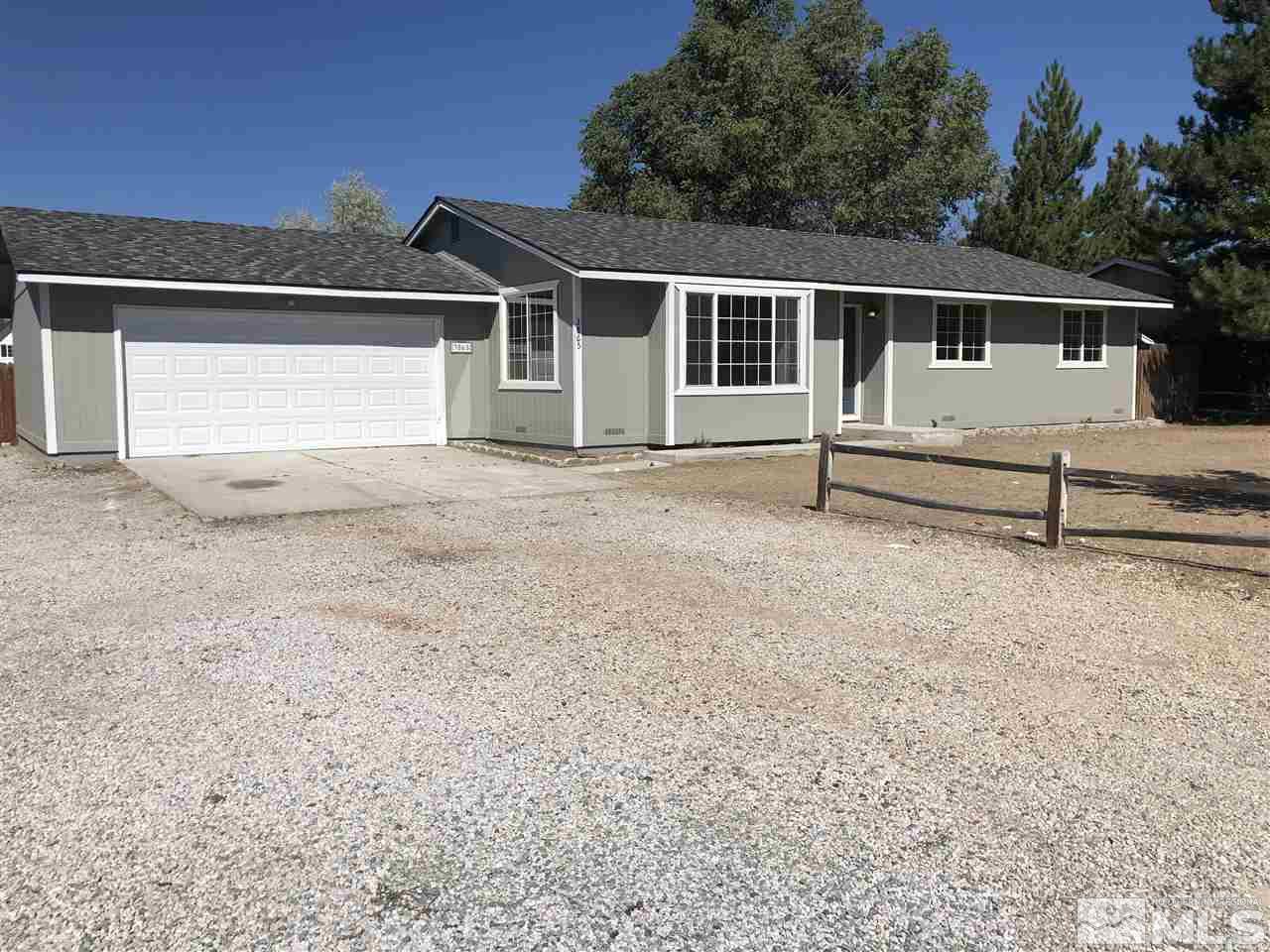 3865 Snipe Drive Reno, NV 89508 - Photo 3 of 19 front view of white house with a yard