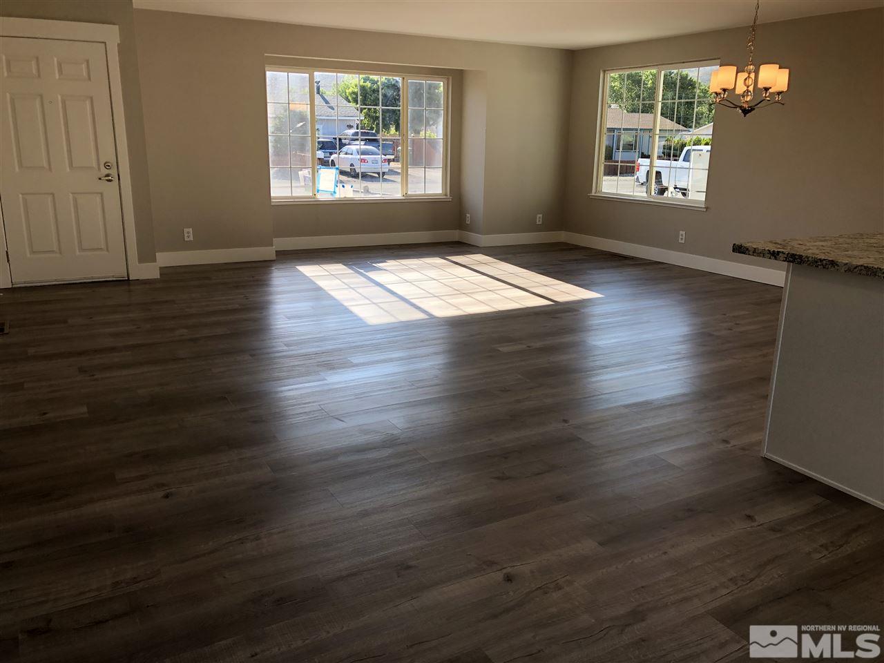 3865 Snipe Drive Reno, NV 89508 - Photo 4 of 19 an empty room with wooden floor windows and closet
